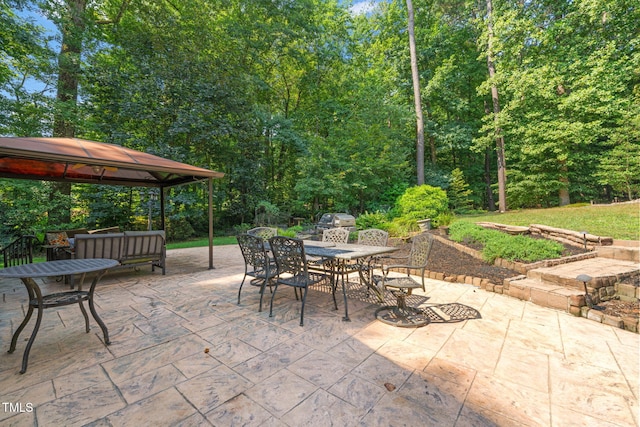 9009 Hometown Dr, Raleigh, NC 27615 - view of patio featuring a gazebo and outdoor dining space