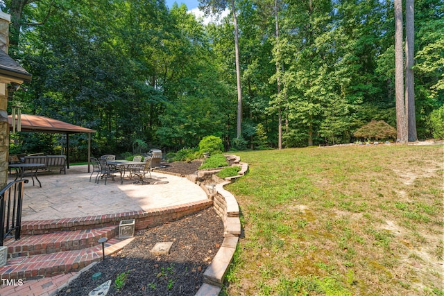 9009 Hometown Dr, Raleigh, NC 27615 - view of green lawn featuring a gazebo and a patio area
