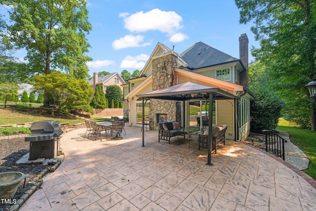 9009 Hometown Dr, Raleigh, NC 27615 - view of patio featuring grilling area, a gazebo, an outdoor living space, and outdoor dining area