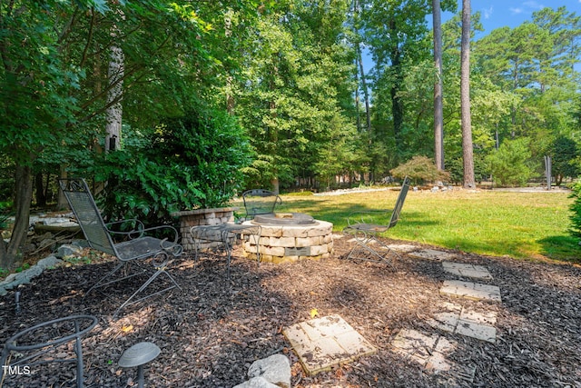 9009 Hometown Dr, Raleigh, NC 27615 - view of green lawn featuring an outdoor fire pit