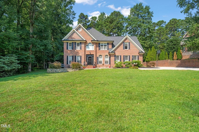 9009 Hometown Dr, Raleigh, NC 27615 - colonial inspired home with brick siding and a front yard