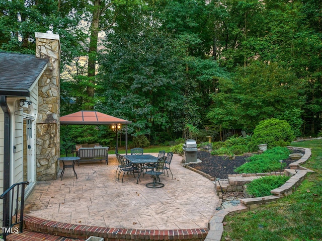 9009 Hometown Dr, Raleigh, NC 27615 - view of patio with area for grilling, a gazebo, and outdoor dining area