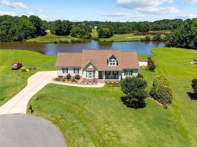 34 Westchester Ln, Angier, NC 27501 - view of front of property featuring a water view, concrete driveway, covered porch, and a front lawn