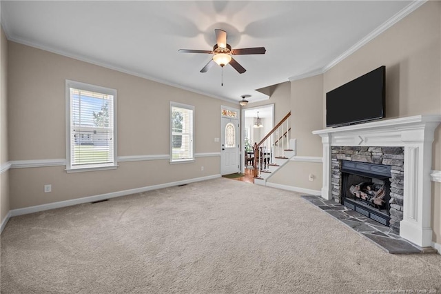 34 Westchester Ln, Angier, NC 27501 - unfurnished living room featuring carpet, ornamental molding, a ceiling fan, a stone fireplace, and stairway