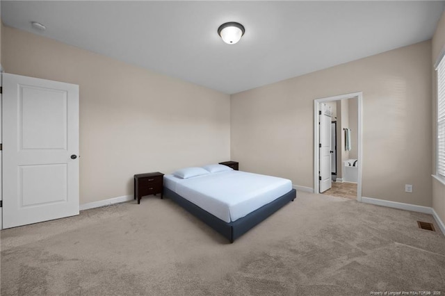 34 Westchester Ln, Angier, NC 27501 - carpeted bedroom featuring baseboards and ensuite bath