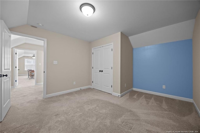 34 Westchester Ln, Angier, NC 27501 - unfurnished bedroom with lofted ceiling, carpet flooring, and a closet
