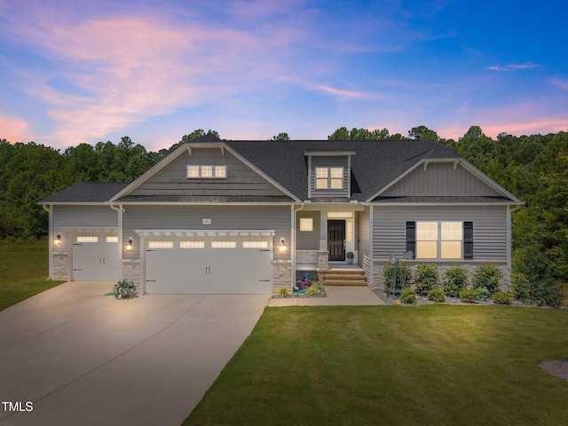40 Cinnamon Teal Way, Youngsville, NC 27596 - craftsman inspired home featuring stone siding, an attached garage, driveway, a yard, and roof with shingles
