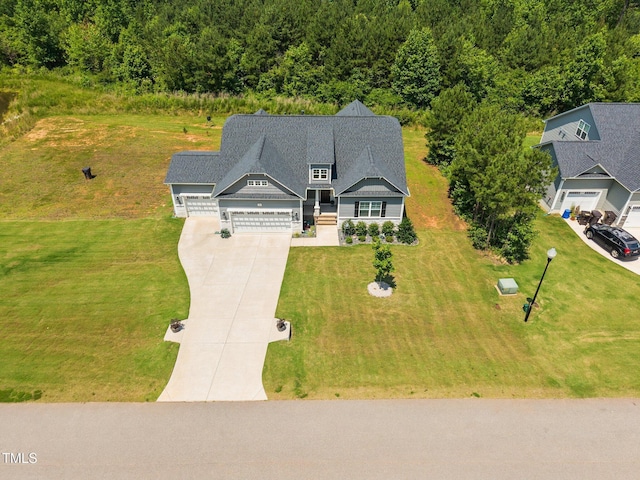 40 Cinnamon Teal Way, Youngsville, NC 27596 - aerial view of property and surrounding area featuring a heavily wooded area