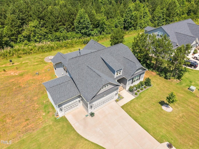40 Cinnamon Teal Way, Youngsville, NC 27596 - aerial view of property and surrounding area with a heavily wooded area