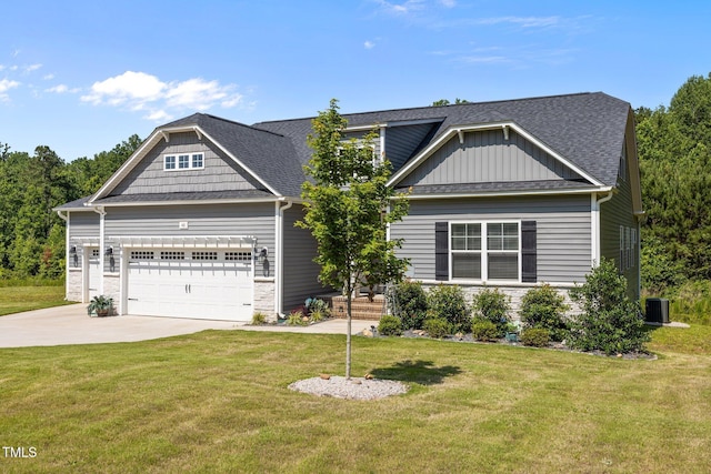 40 Cinnamon Teal Way, Youngsville, NC 27596 - craftsman house with concrete driveway, an attached garage, a front yard, and roof with shingles