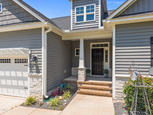 40 Cinnamon Teal Way, Youngsville, NC 27596 - entrance to property featuring covered porch, roof with shingles, and board and batten siding