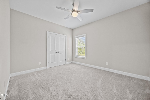 40 Cinnamon Teal Way, Youngsville, NC 27596 - unfurnished bedroom with carpet floors, a closet, and a ceiling fan