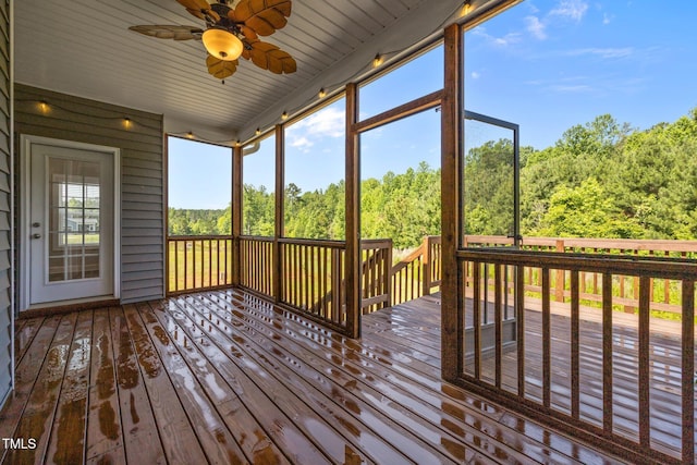 40 Cinnamon Teal Way, Youngsville, NC 27596 - unfurnished sunroom with a ceiling fan and a wooded view