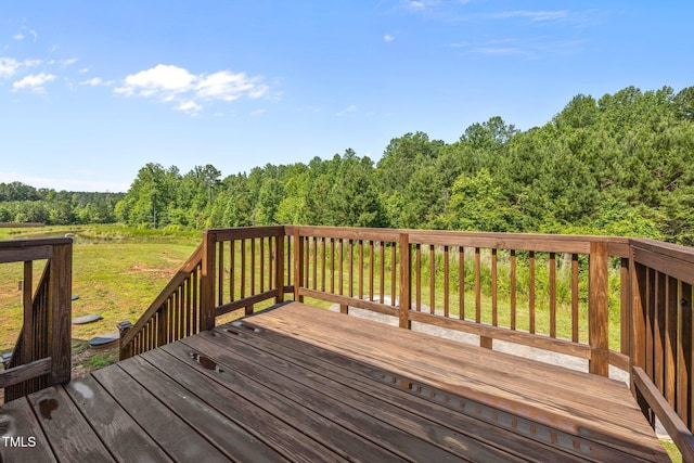 40 Cinnamon Teal Way, Youngsville, NC 27596 - wooden terrace with a wooded view