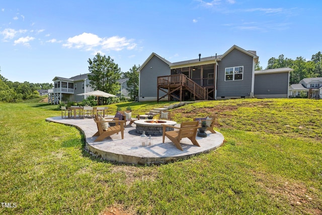 40 Cinnamon Teal Way, Youngsville, NC 27596 - view of green lawn with stairs, a patio, a fire pit, and a wooden deck