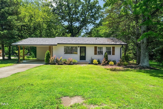 313 13th St, Butner, NC 27509 - view of front facade featuring concrete driveway, a front lawn, and a carport