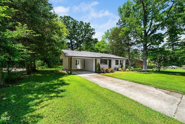 313 13th St, Butner, NC 27509 - ranch-style home with concrete driveway, an attached carport, and a front lawn