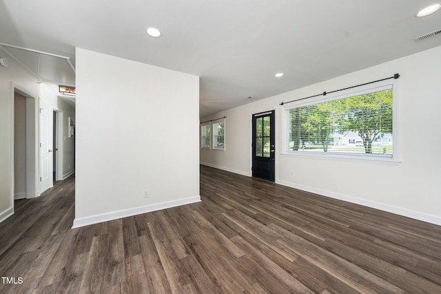 313 13th St, Butner, NC 27509 - spare room with attic access, dark wood finished floors, and recessed lighting