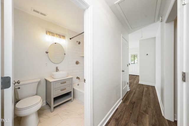 313 13th St, Butner, NC 27509 - bathroom featuring vanity, bathing tub / shower combination, and wood finished floors