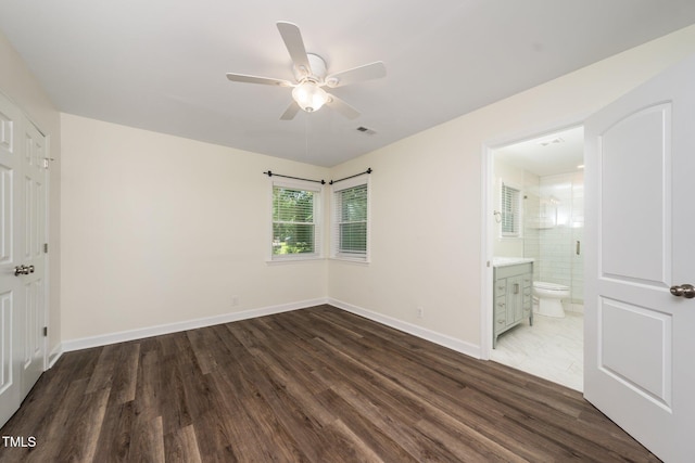 313 13th St, Butner, NC 27509 - unfurnished bedroom featuring wood finished floors, ensuite bathroom, and ceiling fan