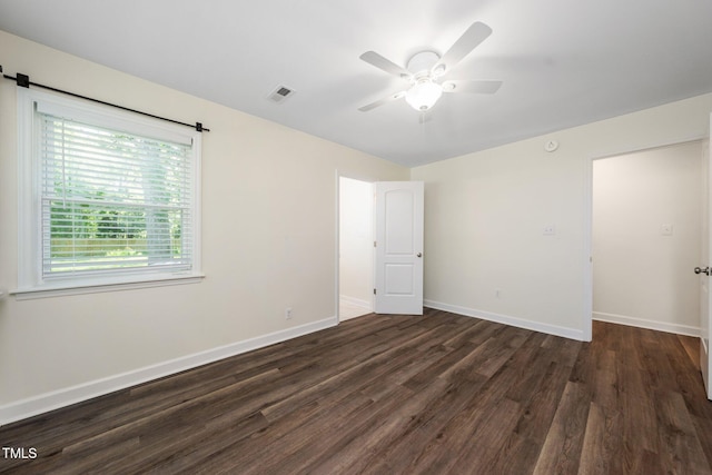 313 13th St, Butner, NC 27509 - unfurnished bedroom with dark wood finished floors and a ceiling fan