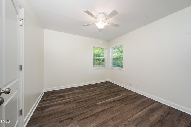 313 13th St, Butner, NC 27509 - empty room with dark wood finished floors and a ceiling fan