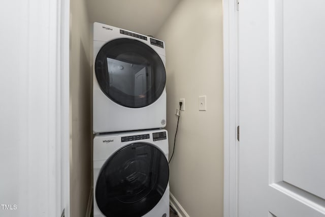 313 13th St, Butner, NC 27509 - washroom with estacked washer and dryer and baseboards