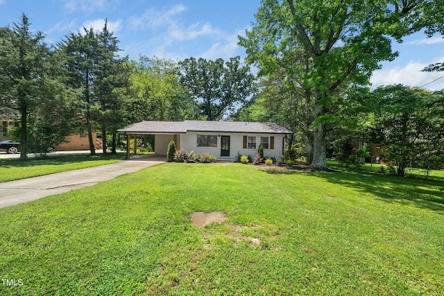 313 13th St, Butner, NC 27509 - ranch-style house with driveway, a carport, and a front lawn