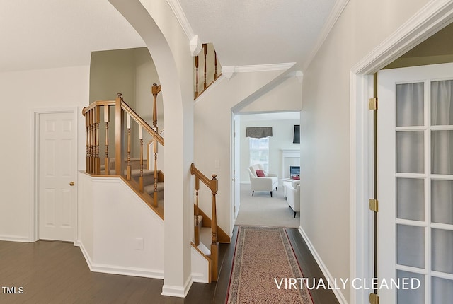3610 Long Ridge Rd, Durham, NC 27703 - hallway with dark wood finished floors, arched walkways, stairs, and ornamental molding