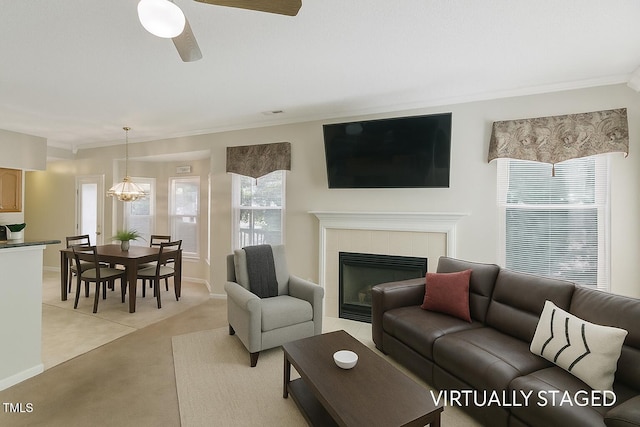 3610 Long Ridge Rd, Durham, NC 27703 - living area featuring ornamental molding, light colored carpet, a fireplace, and a ceiling fan