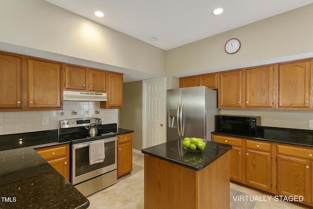 3610 Long Ridge Rd, Durham, NC 27703 - kitchen with stainless steel appliances, under cabinet range hood, brown cabinetry, dark stone counters, and recessed lighting