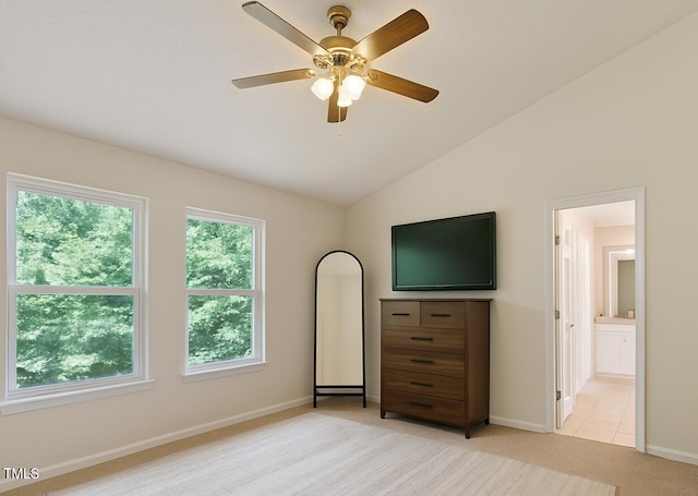 3610 Long Ridge Rd, Durham, NC 27703 - bedroom with light colored carpet, vaulted ceiling, connected bathroom, and a ceiling fan