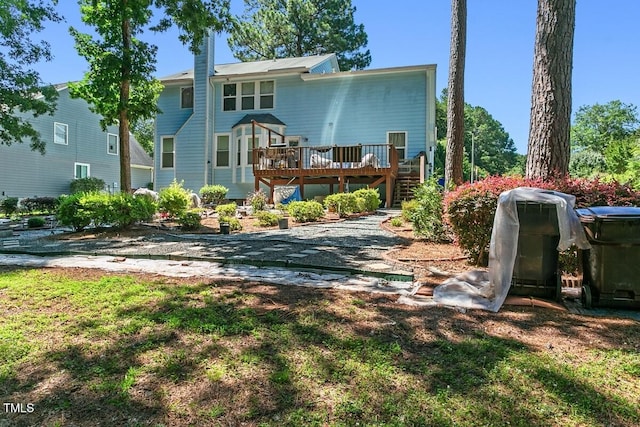 3610 Long Ridge Rd, Durham, NC 27703 - rear view of house with a wooden deck and stairs