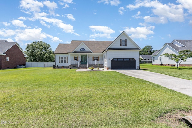 305 Maddux Dr, Pikeville, NC 27863 - view of front of home featuring concrete driveway, a garage, crawl space, and a porch