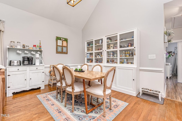 305 Maddux Dr, Pikeville, NC 27863 - dining room with light wood-style floors and high vaulted ceiling