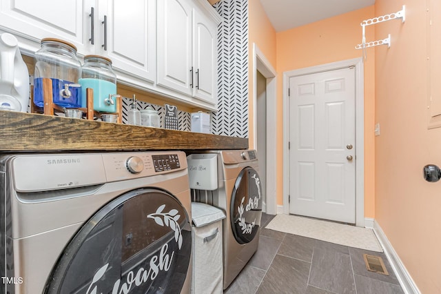 305 Maddux Dr, Pikeville, NC 27863 - washroom with cabinet space and washer and dryer