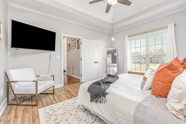 305 Maddux Dr, Pikeville, NC 27863 - bedroom featuring light wood-style flooring, ornamental molding, and ceiling fan