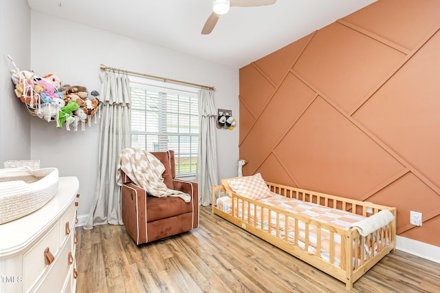 305 Maddux Dr, Pikeville, NC 27863 - bedroom featuring light wood finished floors and ceiling fan