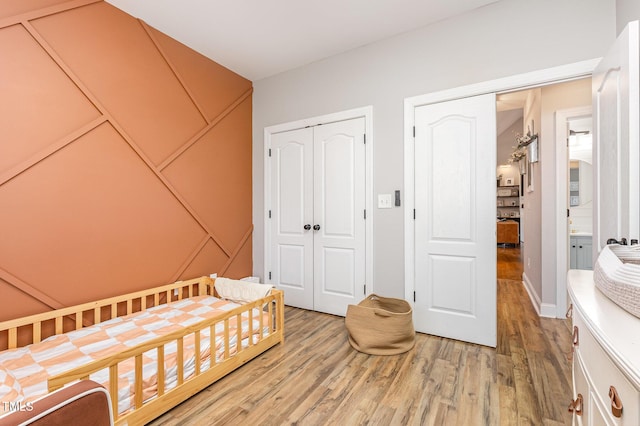 305 Maddux Dr, Pikeville, NC 27863 - bedroom with a closet and light wood-type flooring
