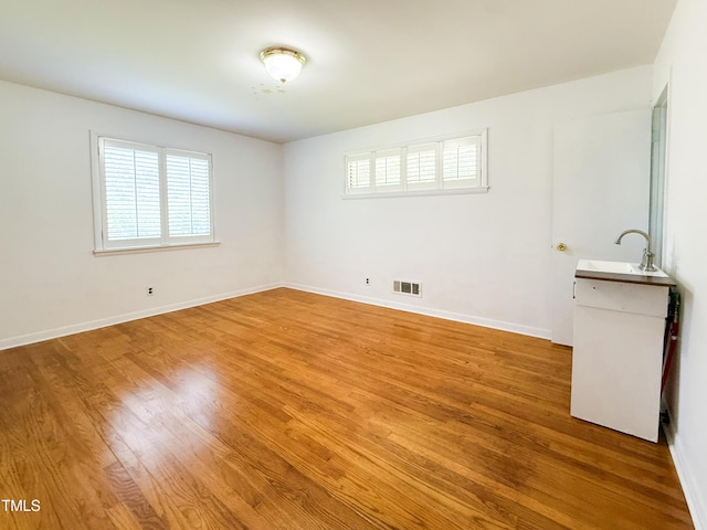3323 Baugh St, Raleigh, NC 27604 - empty room with light wood-type flooring and a sink