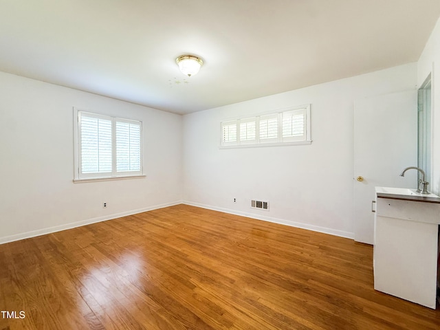 3323 Baugh St, Raleigh, NC 27604 - empty room featuring plenty of natural light and wood finished floors