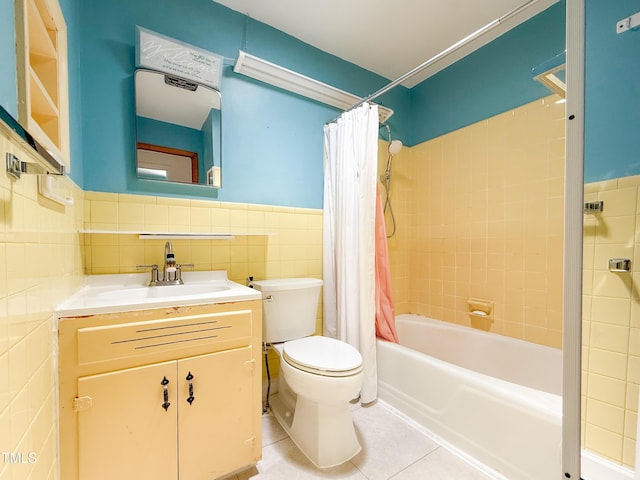 3323 Baugh St, Raleigh, NC 27604 - bathroom with tile walls, tile patterned floors, shower / tub combo, vanity, and wainscoting