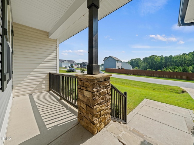 115 Snowy Orchid Ln, Smithfield, NC 27577 - porch featuring a yard and a residential view
