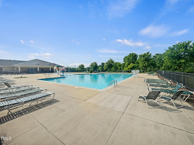 115 Snowy Orchid Ln, Smithfield, NC 27577 - community pool with a patio and a water slide