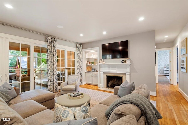 1054 Canterbury Ln, Chapel Hill, NC 27517 - living room with light wood-type flooring, recessed lighting, plenty of natural light, and a fireplace with flush hearth