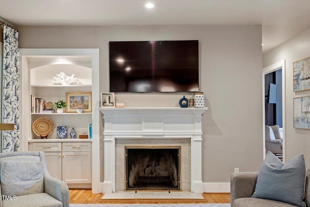 1054 Canterbury Ln, Chapel Hill, NC 27517 - living area with light wood-style flooring, a tile fireplace, and recessed lighting