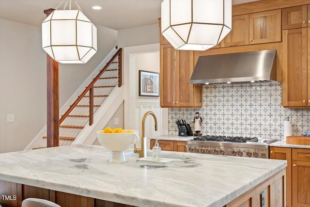 1054 Canterbury Ln, Chapel Hill, NC 27517 - kitchen featuring wall chimney range hood, tasteful backsplash, stainless steel gas stovetop, light stone counters, and recessed lighting