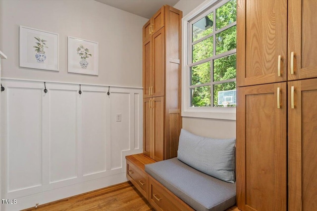 1054 Canterbury Ln, Chapel Hill, NC 27517 - mudroom with a decorative wall, healthy amount of natural light, light wood-style floors, and wainscoting