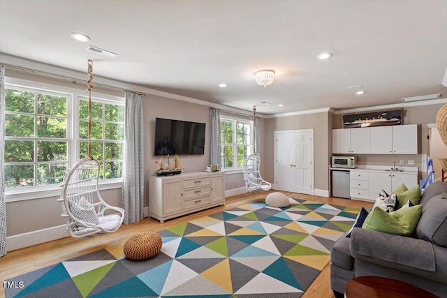 1054 Canterbury Ln, Chapel Hill, NC 27517 - living area featuring ornamental molding, recessed lighting, light wood finished floors, and a dry bar
