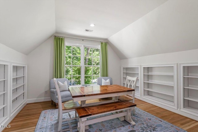 1054 Canterbury Ln, Chapel Hill, NC 27517 - living area with lofted ceiling, light wood-style flooring, and built in shelves